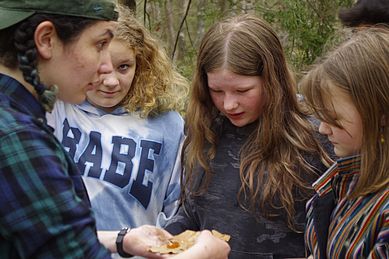 5th and 6th graders get an up close look at a red eft.