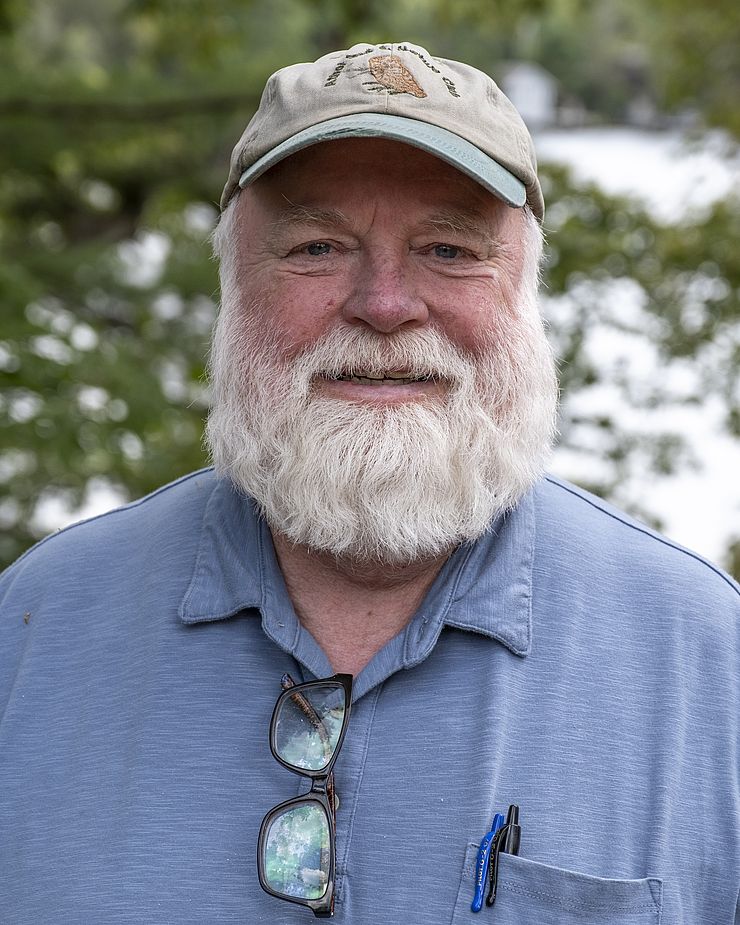 Dave Small in front of forested background